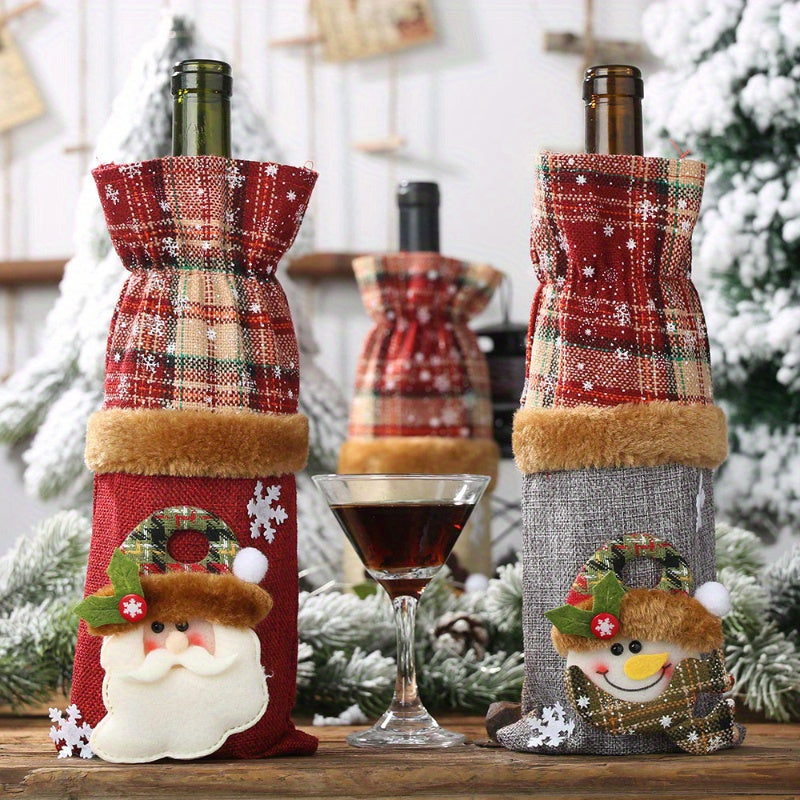 Set of 3 Christmas wine bottle covers in plaid linen with Santa and reindeer design. Hand washable canvas bags for holiday décor and accessories.