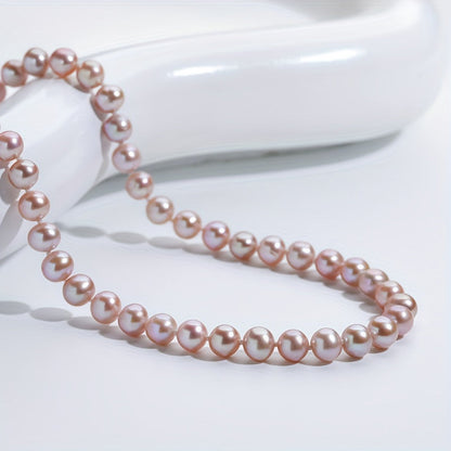 This stunning necklace features 6-7mm pink and purple freshwater cultured pearls. The near-round shape of the pearls adds an elegant touch, while the AAAA+ high luster ensures a dazzling finish. Despite minor flaws, these pearls exude a dainty and