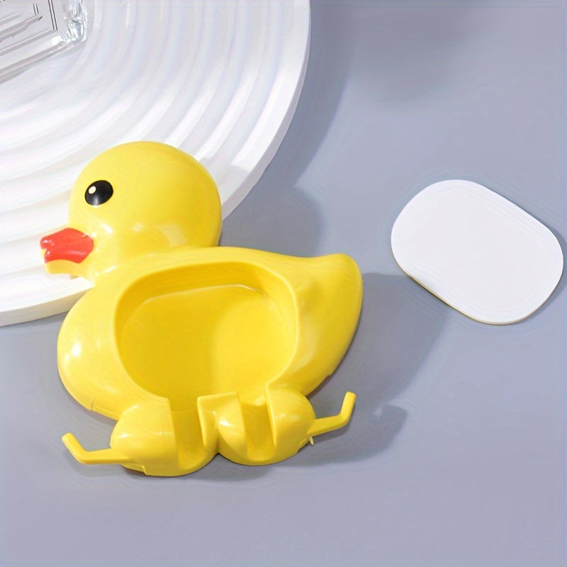 Wall-mounted toothbrush holder with cute duck design, waterproof plastic organizer with suction cup, no-drill installation, home decor.