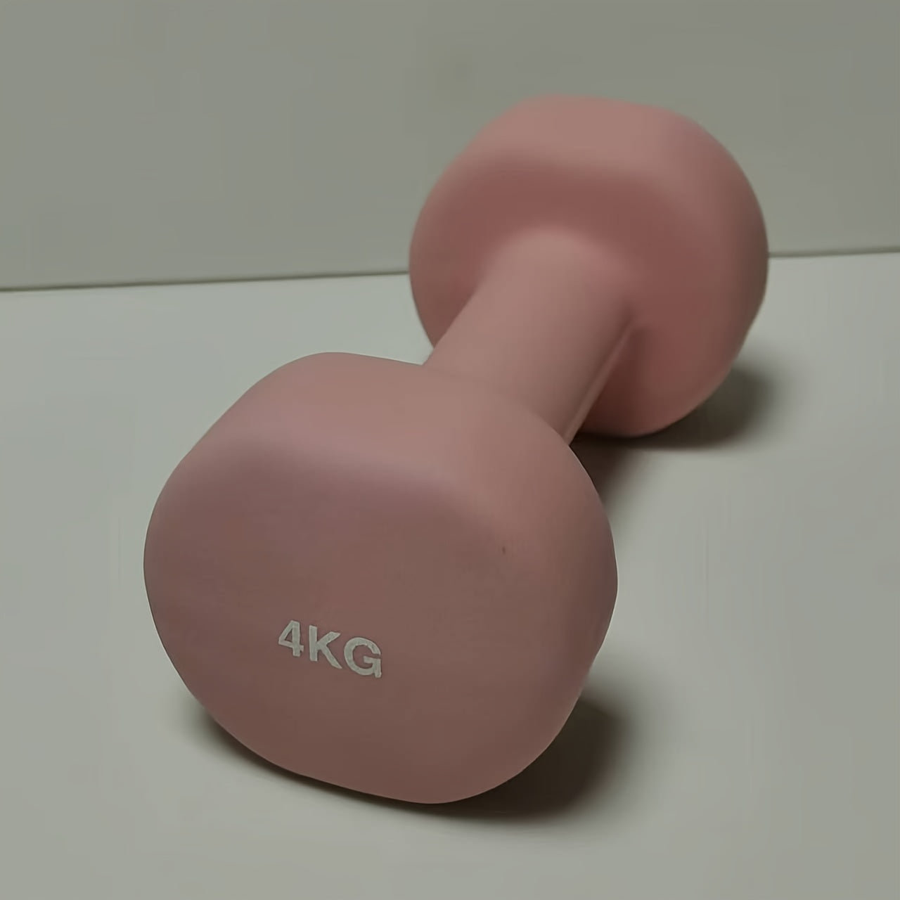 1pc 2kg dumbbell in pink/blue/black colors, made of solid cast iron for home gym. Durable and stylish fitness accessory for both men and women.