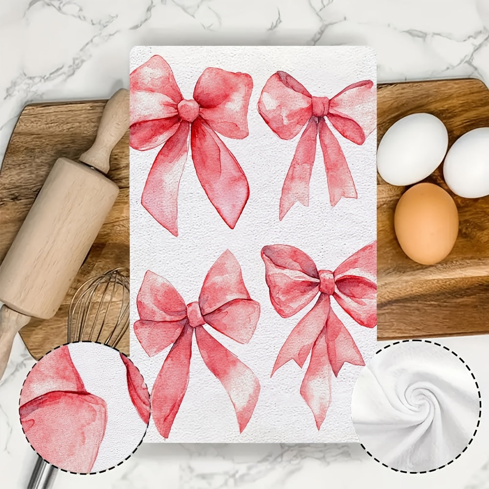 Two ultra soft kitchen towels featuring a Valentine's Day bows design. These towels are highly absorbent, machine washable, and measure 40.64x60.96 cm. The contemporary red bow pattern is perfect for holiday decor.