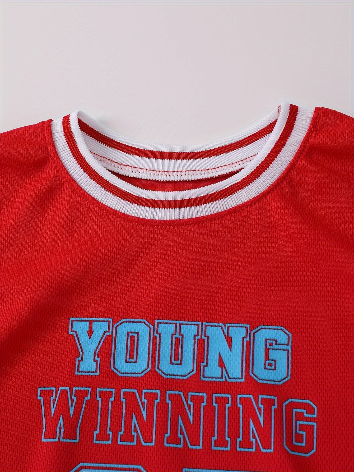 Boy's "Young Winning" casual outfit set includes a round neck t-shirt and shorts, perfect for daily and outdoor wear.