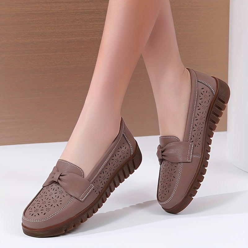 Women's breathable closed toe flat shoes with hollow out design.