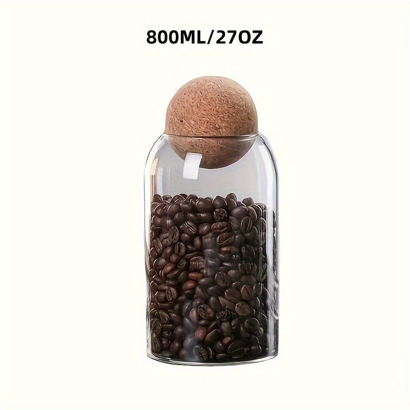 Airtight glass kitchen jars with cork lids for coffee, tea, and spices.