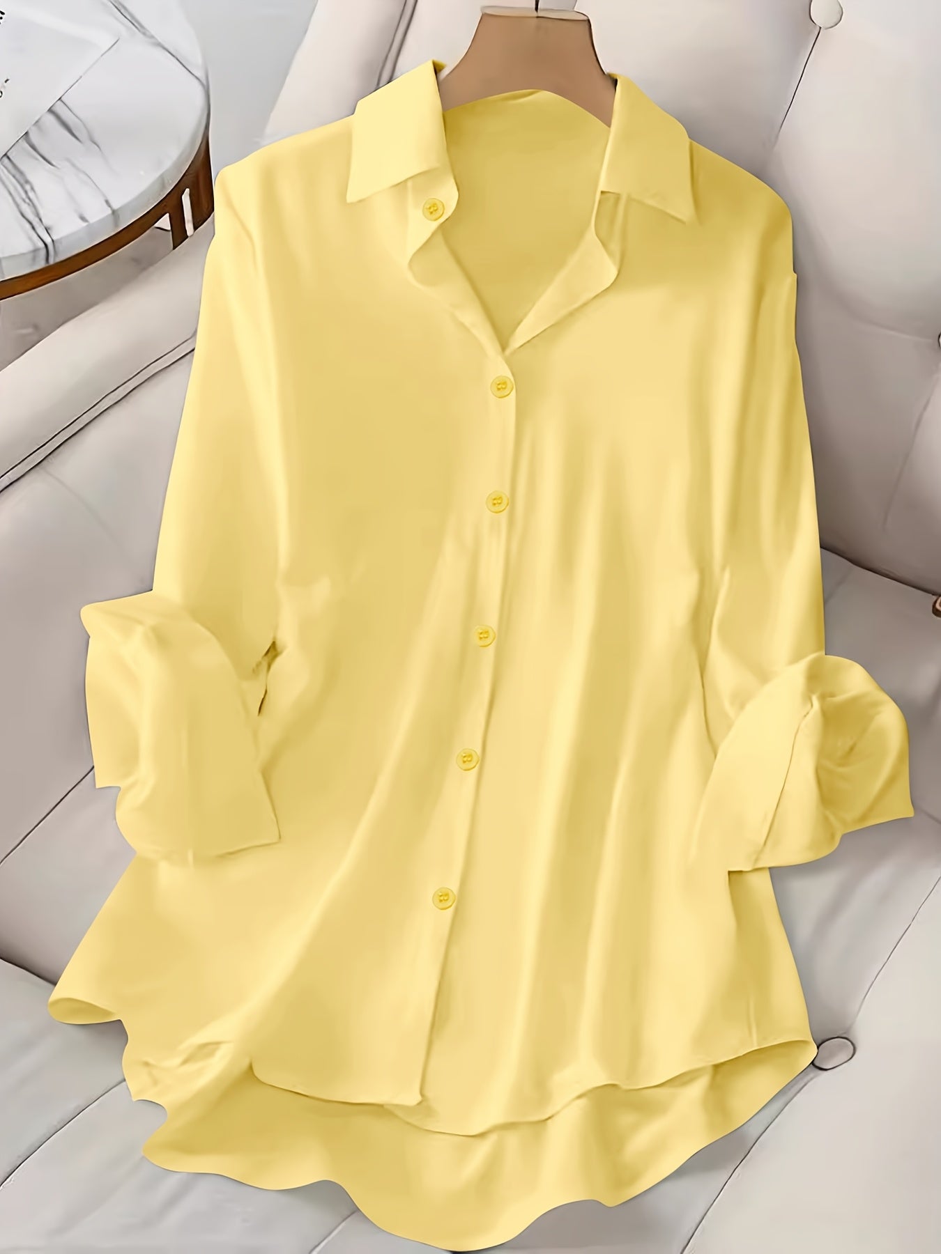 Long sleeve button front shirt in solid color for plus size women.