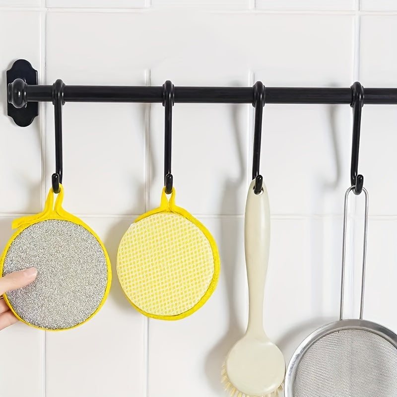 A pack of traceless steel scrubbers in three sizes for double-sided cleaning, suitable for pots and dishes. Ideal for home and kitchen cleaning, reusable and practical.