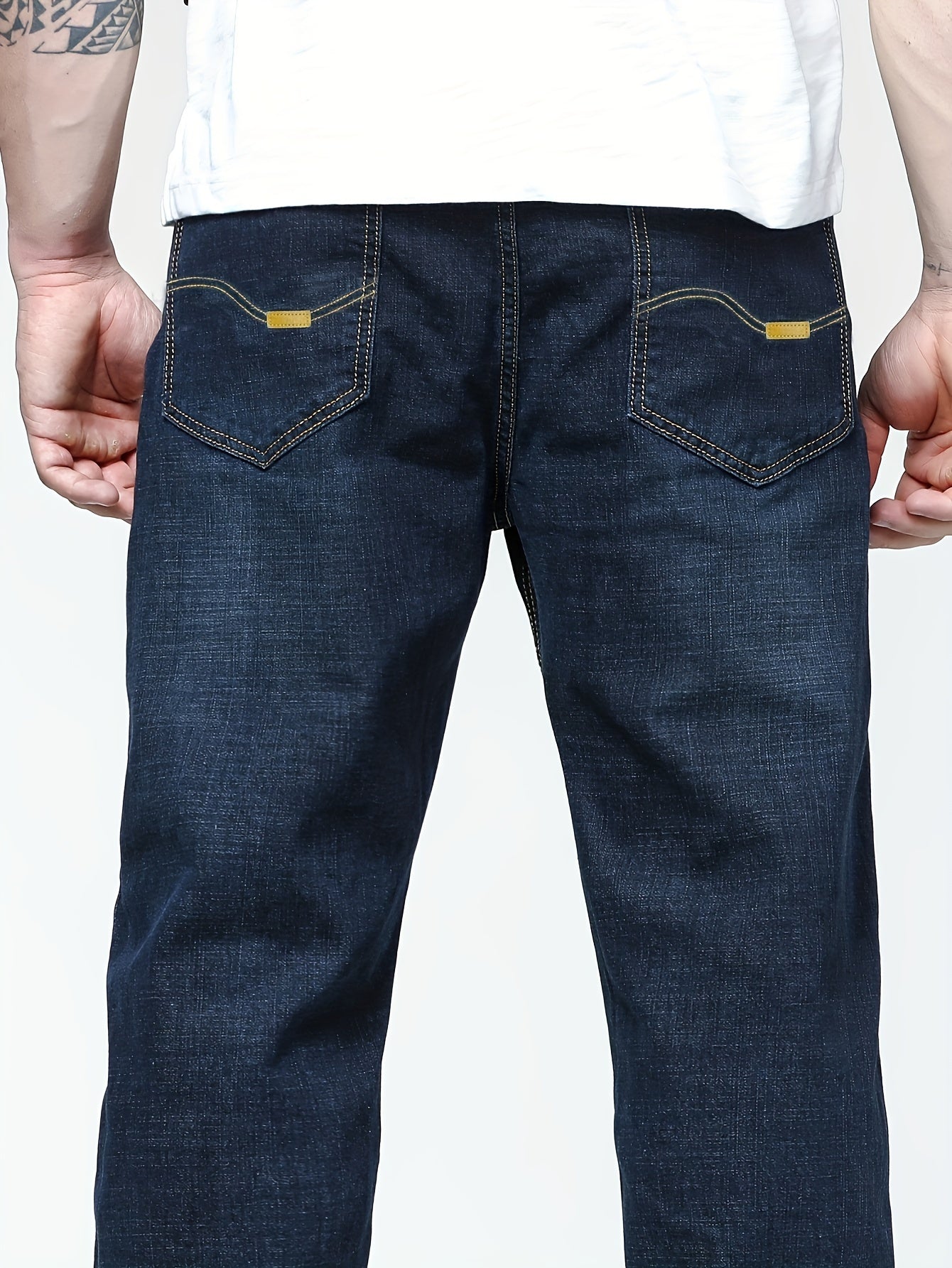 Men's solid denim pants for spring and fall in plus sizes.