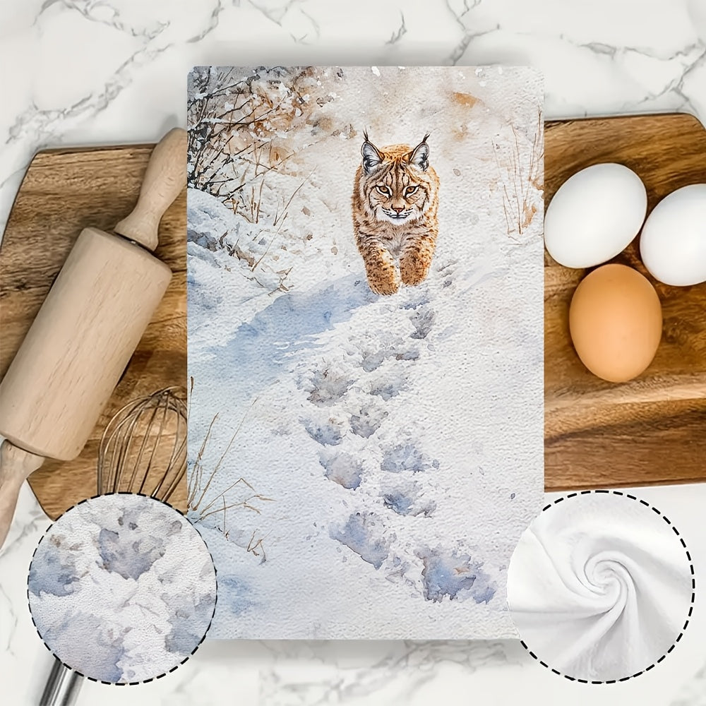 Two pieces of Lynx Snow Footprints kitchen towels, made of super absorbent polyester knit fabric. These towels are machine washable and feature a contemporary coastal style, measuring 40.64x60.96 cm. They are perfect as dish hand towels for holiday decor.