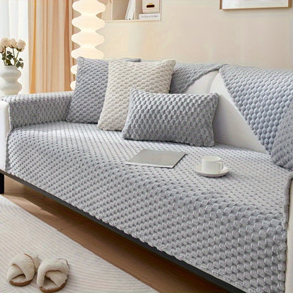 Non-slip sofa cover with honeycomb pattern, ideal for all seasons and protecting furniture in any room.