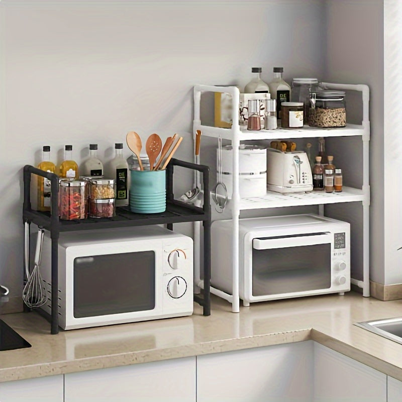 A modern kitchen storage shelf with stainless steel microwave stand and double layer, multi-layer oven rack organizer. Made with metal and plastic materials, this contemporary all-in-one piece is perfect for the dining room and requires no assembly.