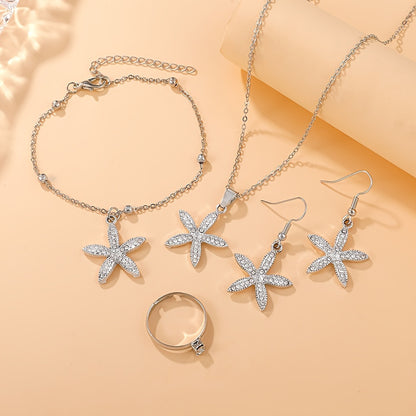 Luxurious 5-piece jewelry set with floral pendant necklace, bracelet, earrings, and rings. Perfect gift for her or mom.