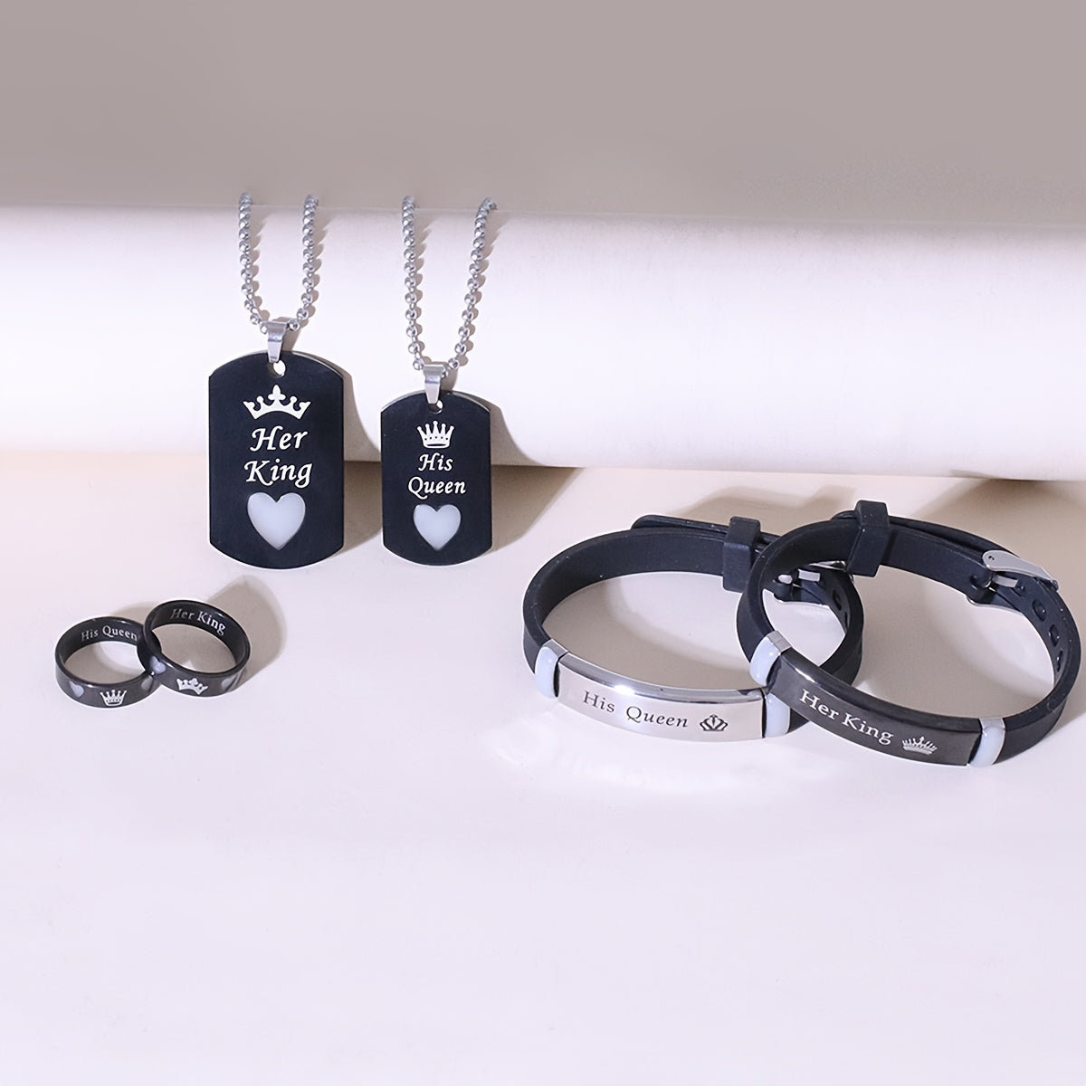 6-piece set of lumious love crown stainless steel jewelry for couples, including necklace, bracelet, and ring.