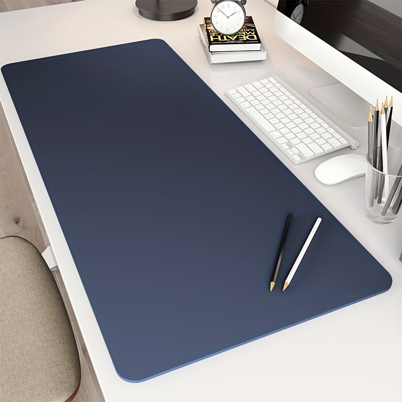 Large waterproof faux leather desk mat in black, durable and easy to clean. Ideal for writing and computer work in office or home settings.