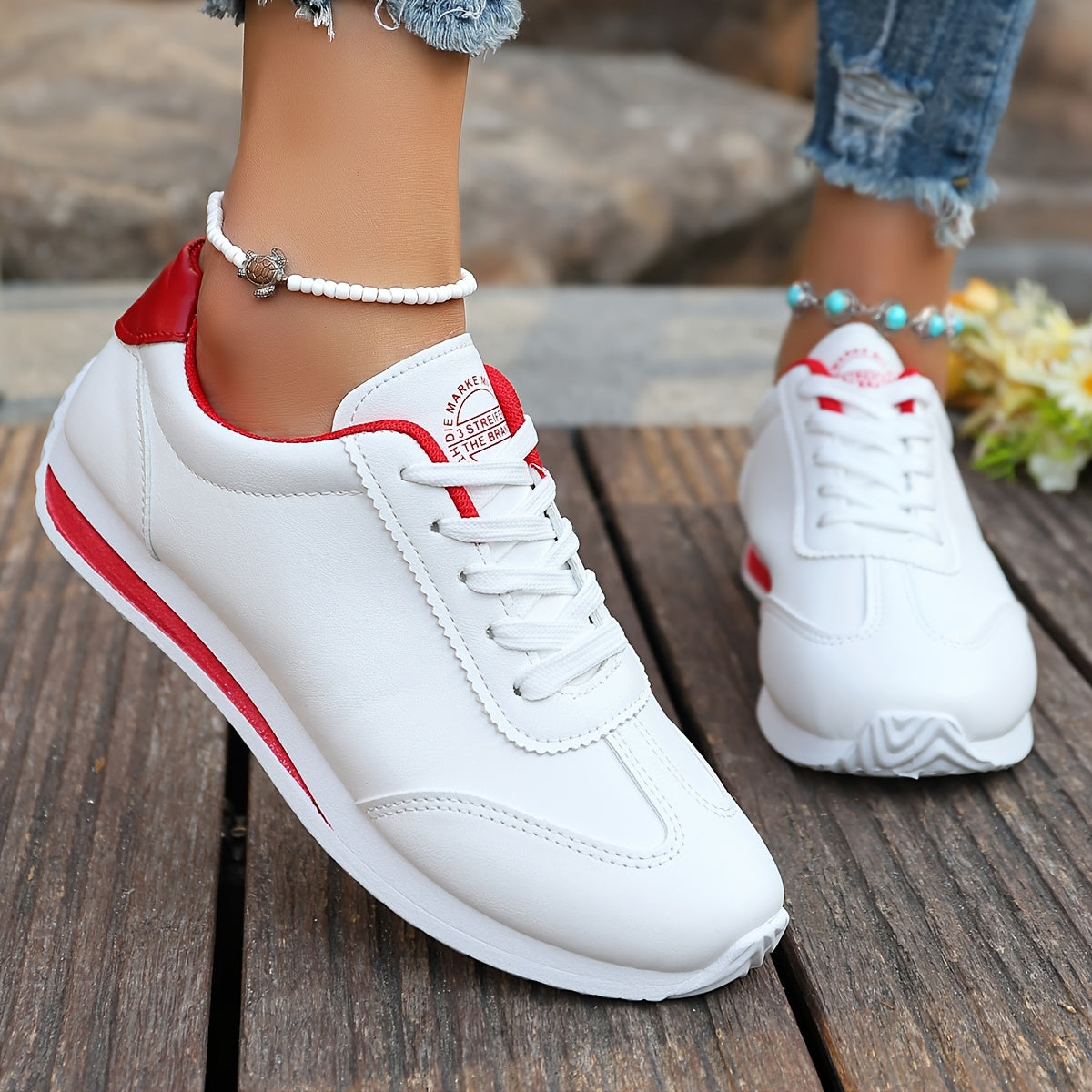 White synthetic leather women's casual sneakers with stability support, all-season comfort, and breathable fabric lining. Perfect for casual attire.