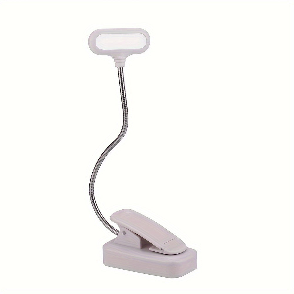 Portable LED book light with adjustable arm, push button control, and polished finish. Battery not included.