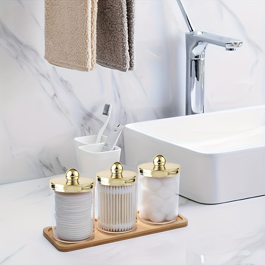 3-piece Qtip holder with tray, acrylic apothecary jars and lids for bathroom storage.