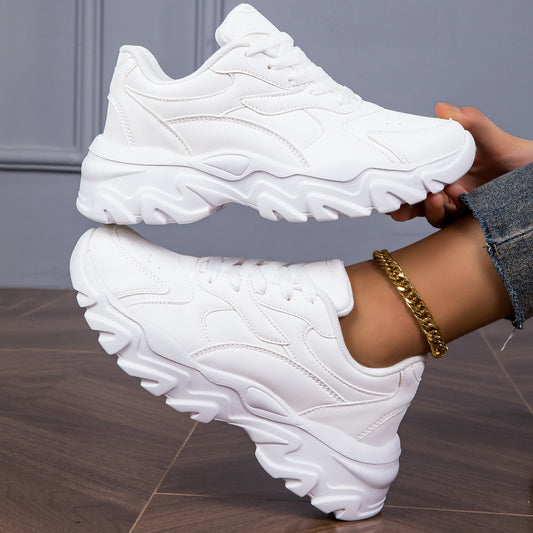 Women's white low-top lace-up sneakers for casual walks and shopping.