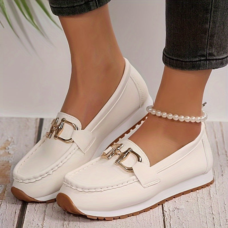 Solid color loafers for women with metallic buckle, soft sole, and closed toe for casual wear.