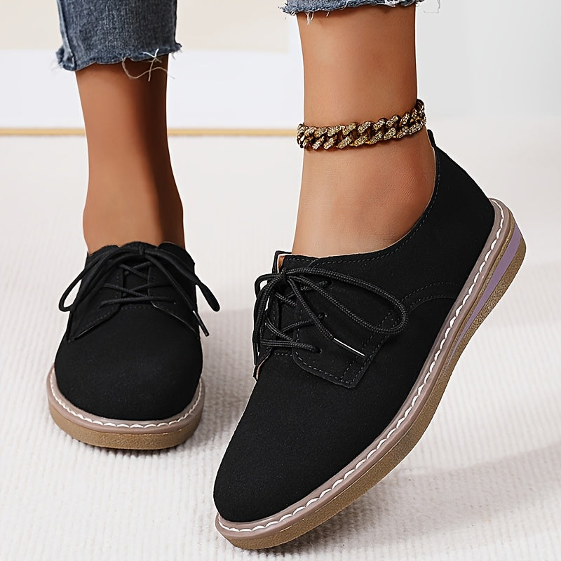 Women's lace-up flats with brogue embellishment, all-season comfort, man-made materials, TPR sole.