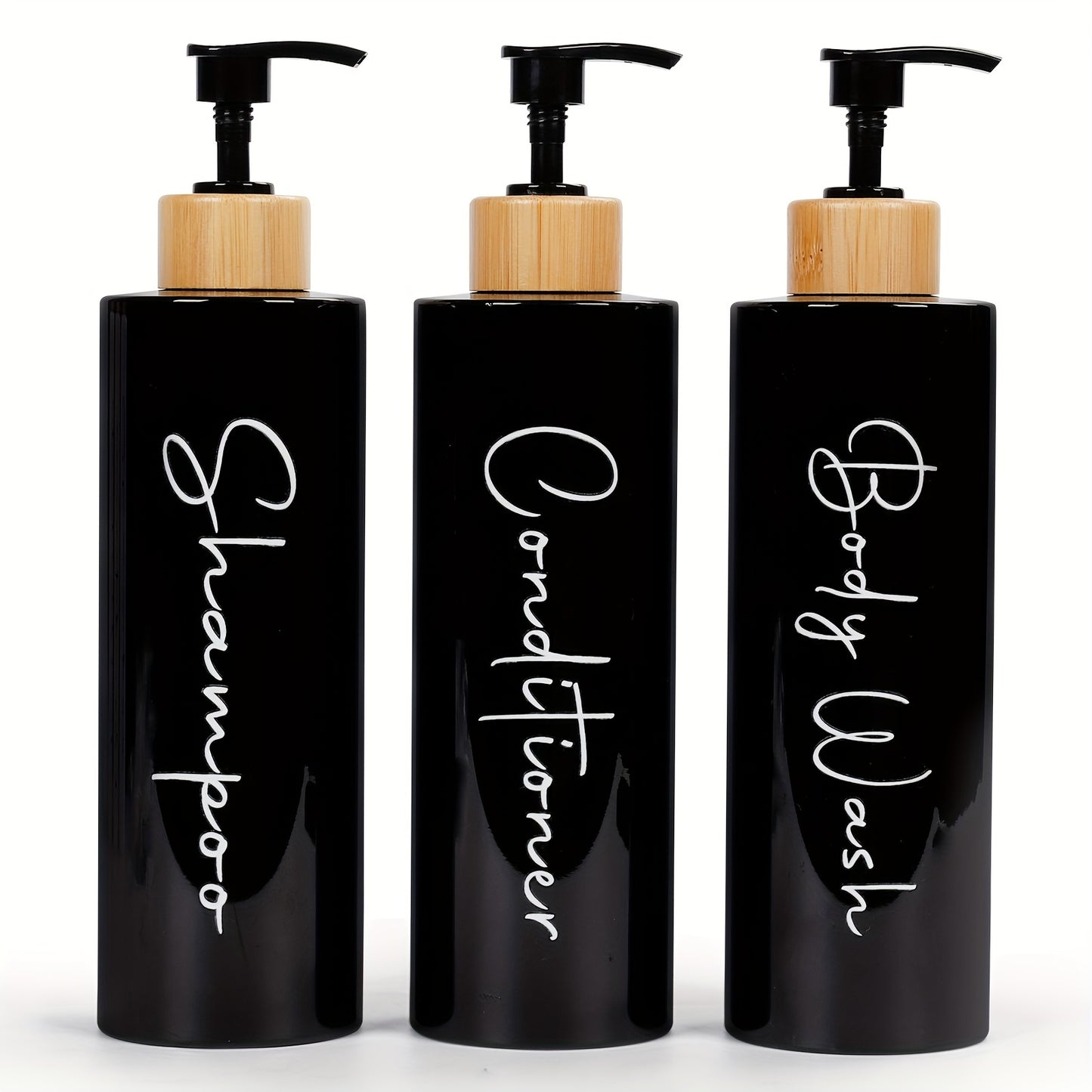 3-piece black and white shampoo and conditioner dispenser set holds 27 oz. Features refillable pump bottles with permanent labels. Made of plastic, lead-free, freestanding, no electricity needed.