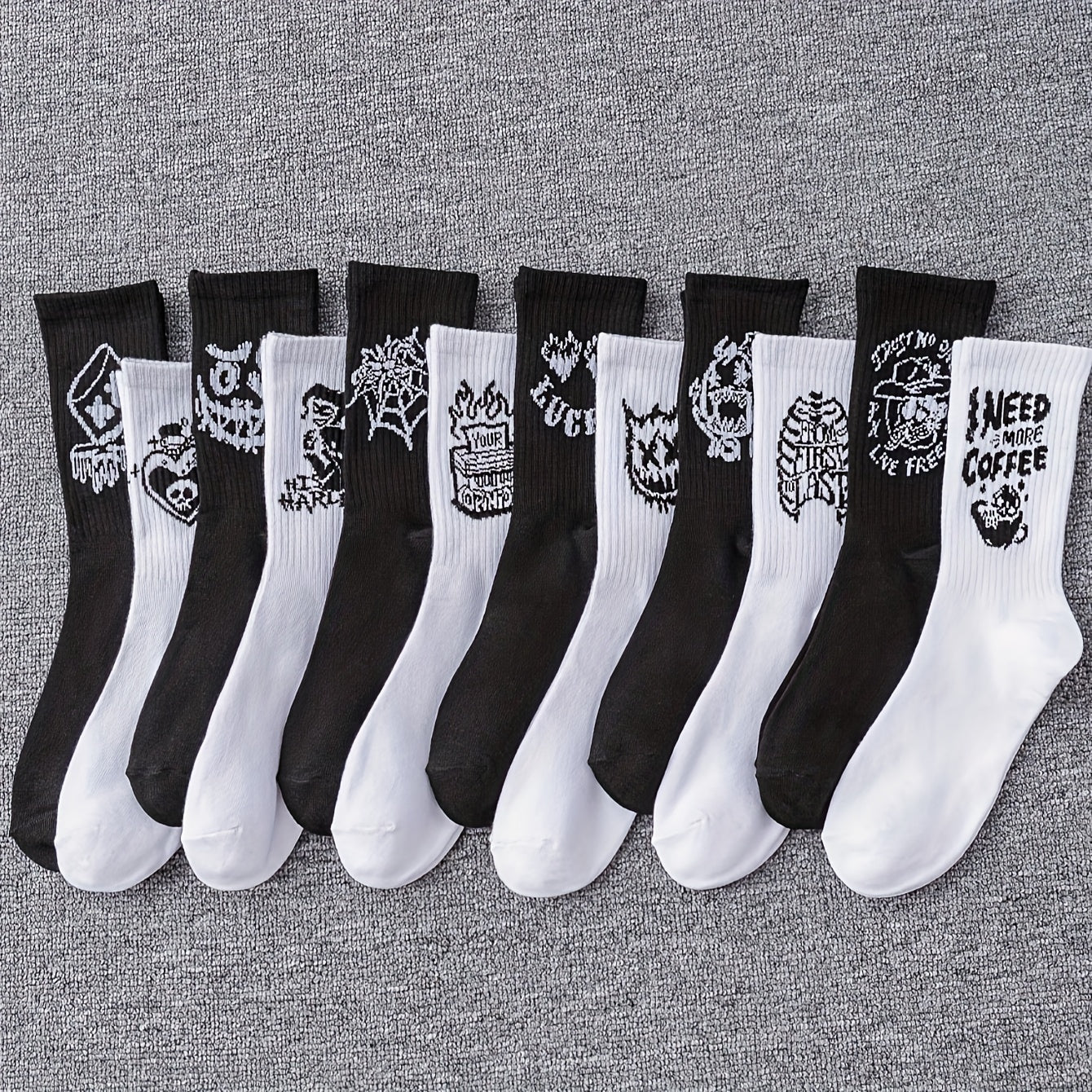 6/10 pairs of men's mid-calf socks with random black and white graffiti designs for all seasons.