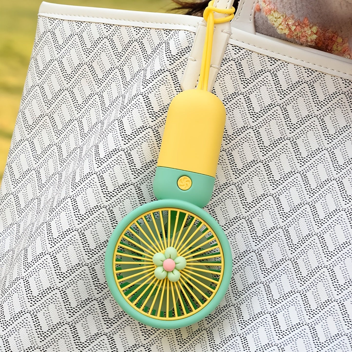 Summer flower color block portable handheld mini fan with USB chargeable feature.