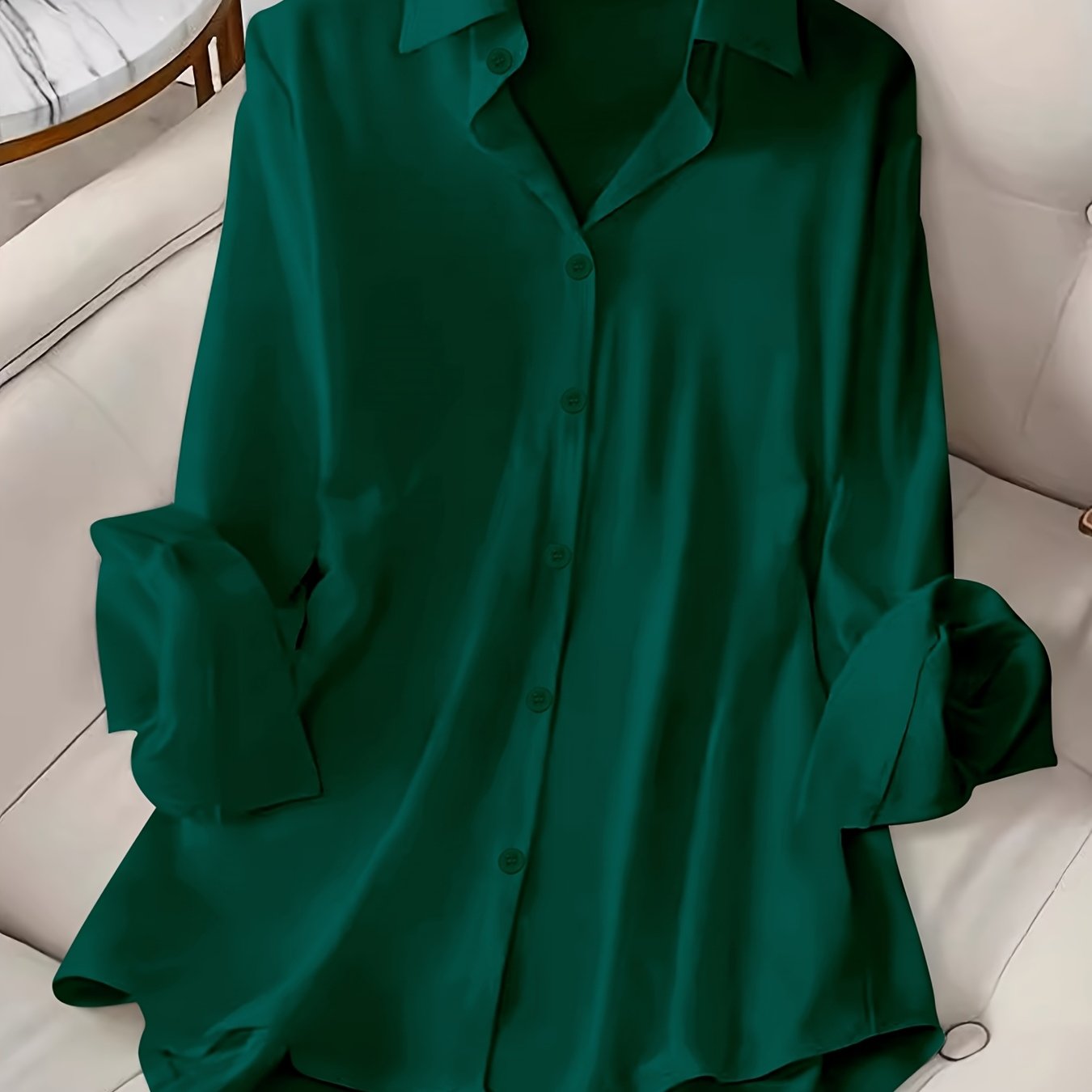 Long sleeve button front shirt in solid color for plus size women.