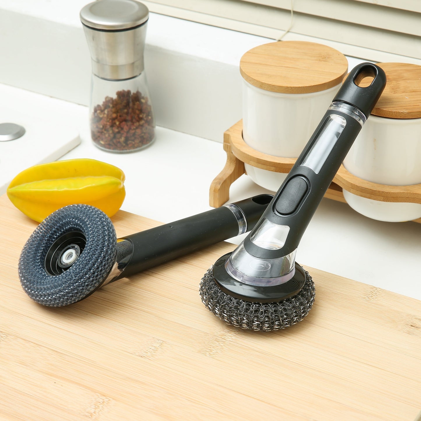 This essential kitchen tool is a durable and versatile cleaning brush with a built-in soap dispenser. Perfect for pots, pans, and dishes, this reusable scrubber is a must-have for any home.