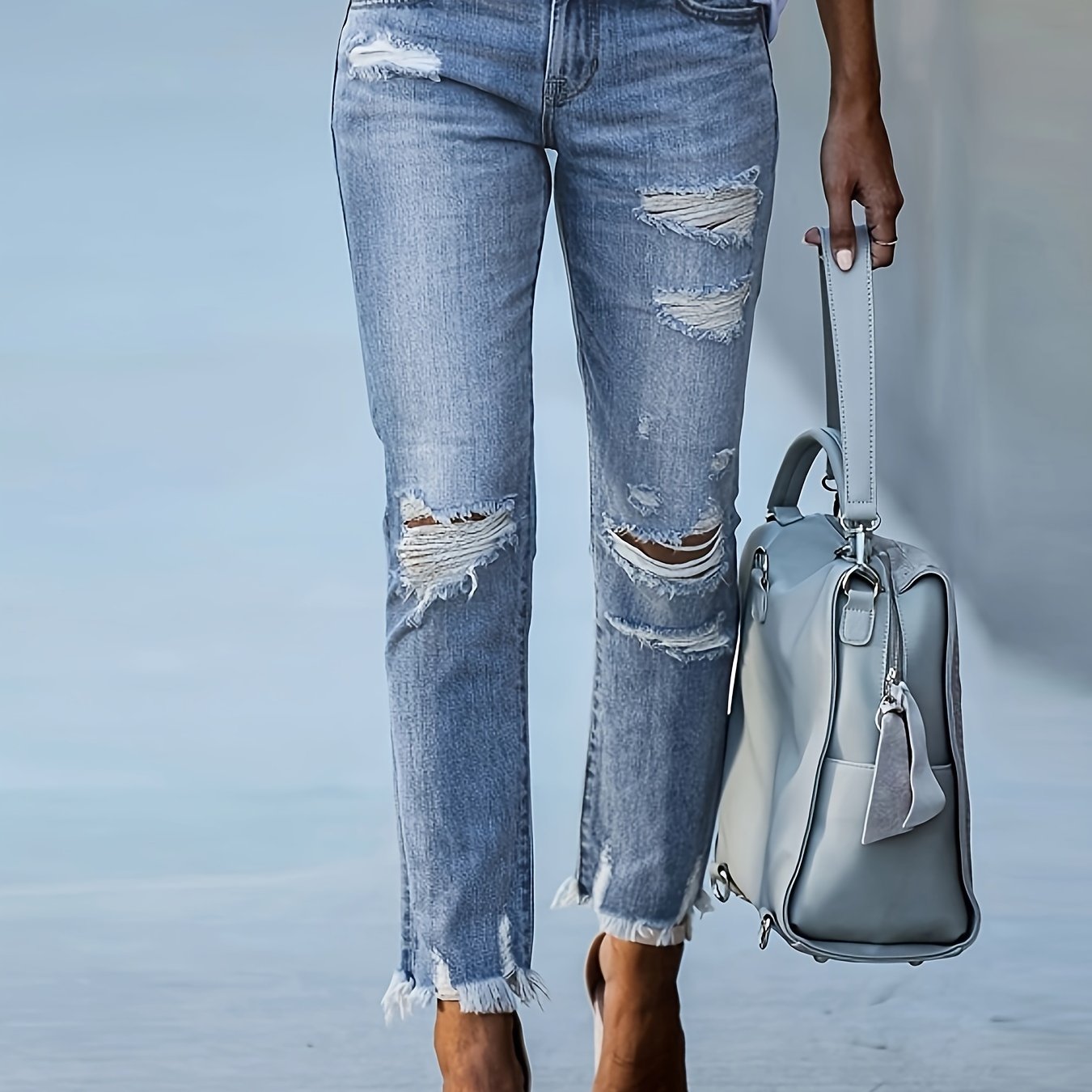 Elegant women's denim jeans with solid color, high elasticity, mid-rise waist, straight fit, 9-inch length, zipper closure, and pockets - perfect for any season and going out.