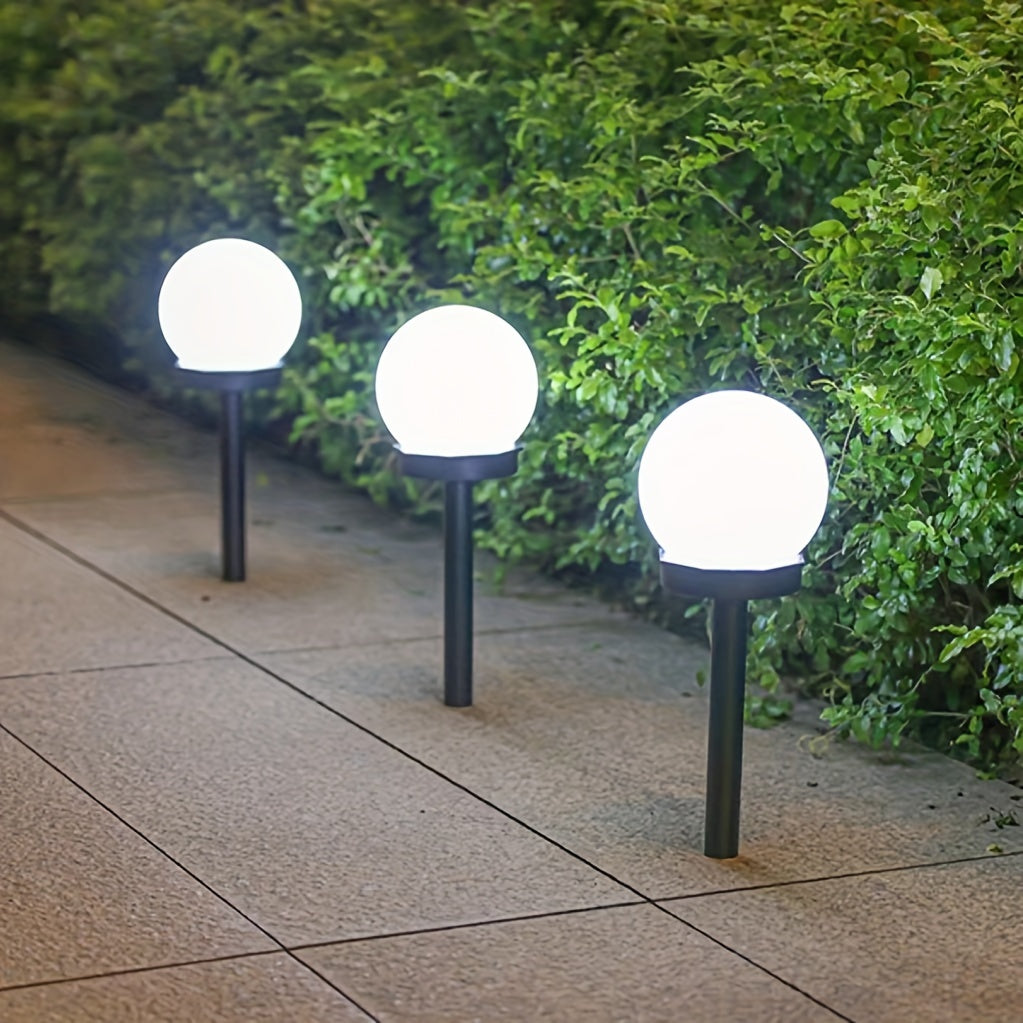 Solar-powered LED garden lights for outdoor landscapes - Durable plastic, automatic on/off, modern design for pathways, yards, decks, lawns, and patios.