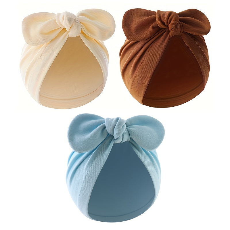 Three-pack of cotton baby turban hats with bow, suitable for newborns to 3 years old. Hand washable and lightweight, perfect for birthdays and fantasy themes.