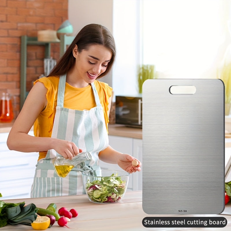 Durable Stainless Steel Cutting Board, with double-sided design, measuring 22.99 x 34.04 cm. This metal cutting board is food-safe, easy to clean, and suitable for cutting meat, vegetables, and fruits.