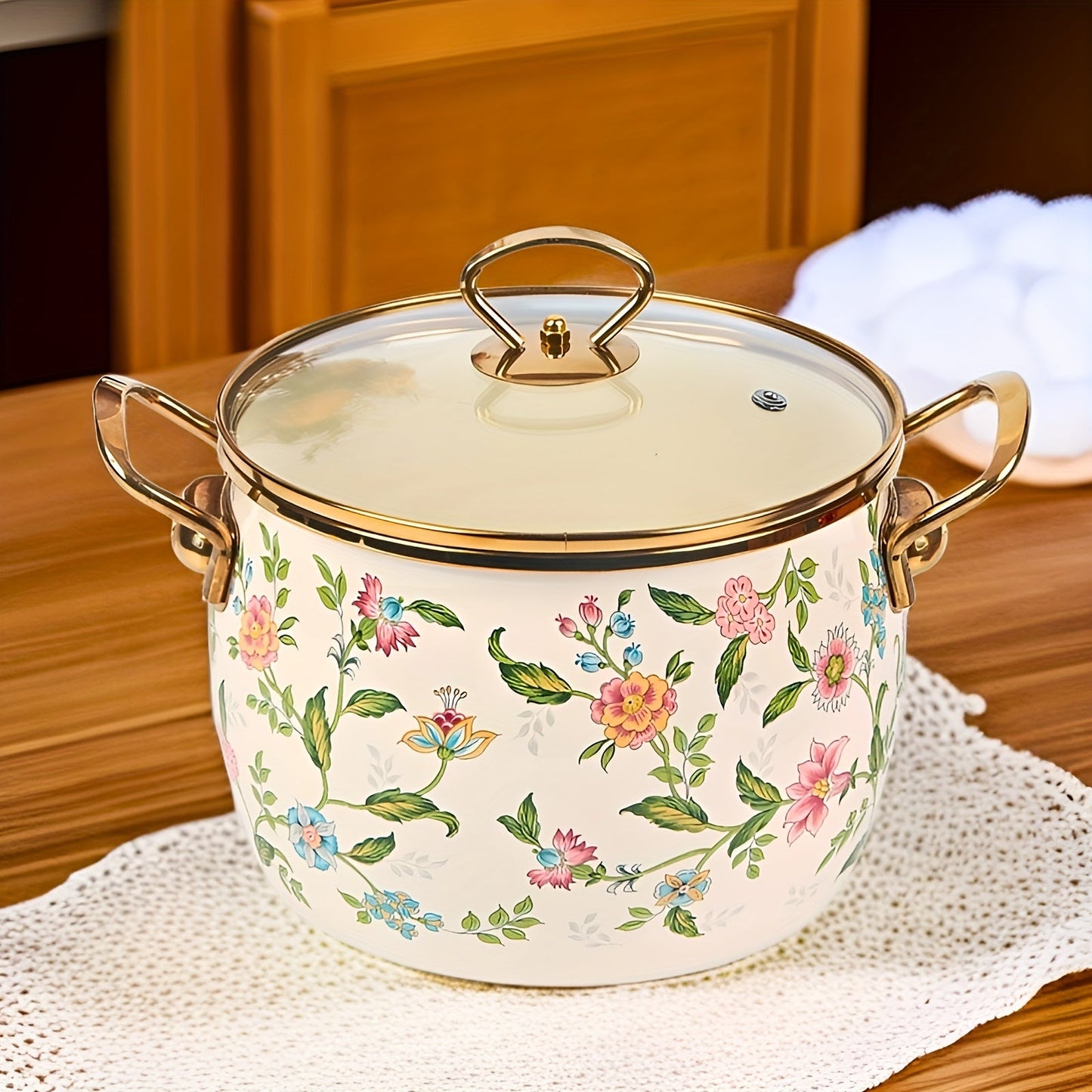 Large capacity enamel saucepan with glass lid and floral design is a non-stick, dishwasher-safe kitchen cookware with double handles. This soup pot features a golden handle for added style and convenience.