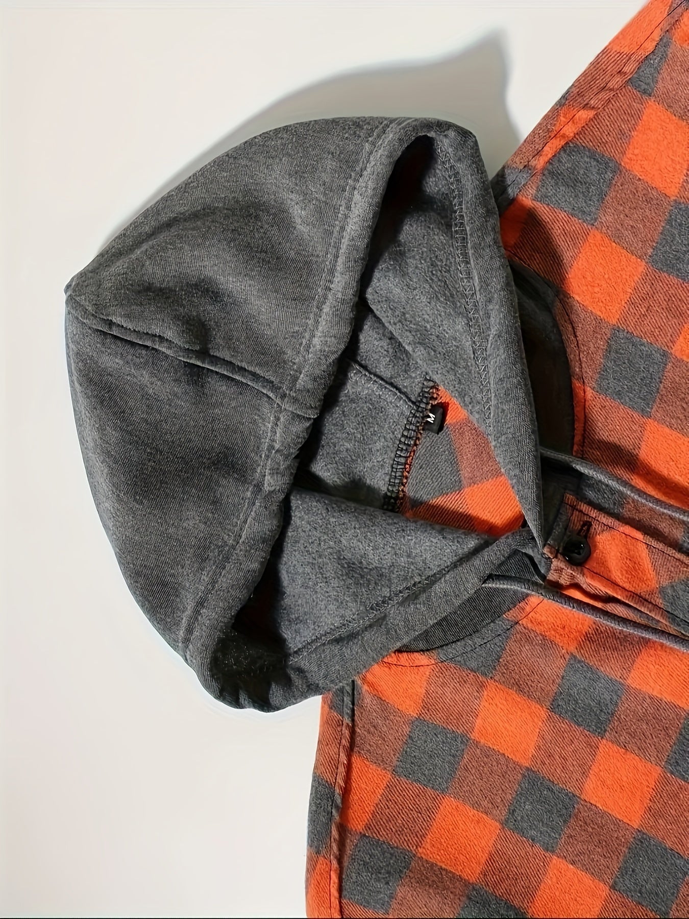 Stylish men's plaid hooded shirt with long sleeves - perfect for casual wear.