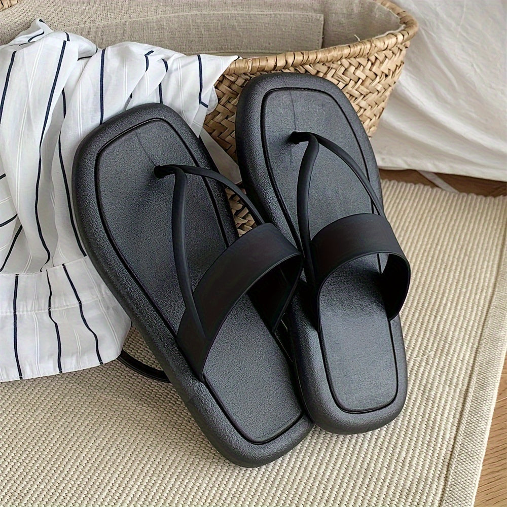 Women's solid color flip flops with soft PVC sole, lightweight and non-slip for casual seaside wear.