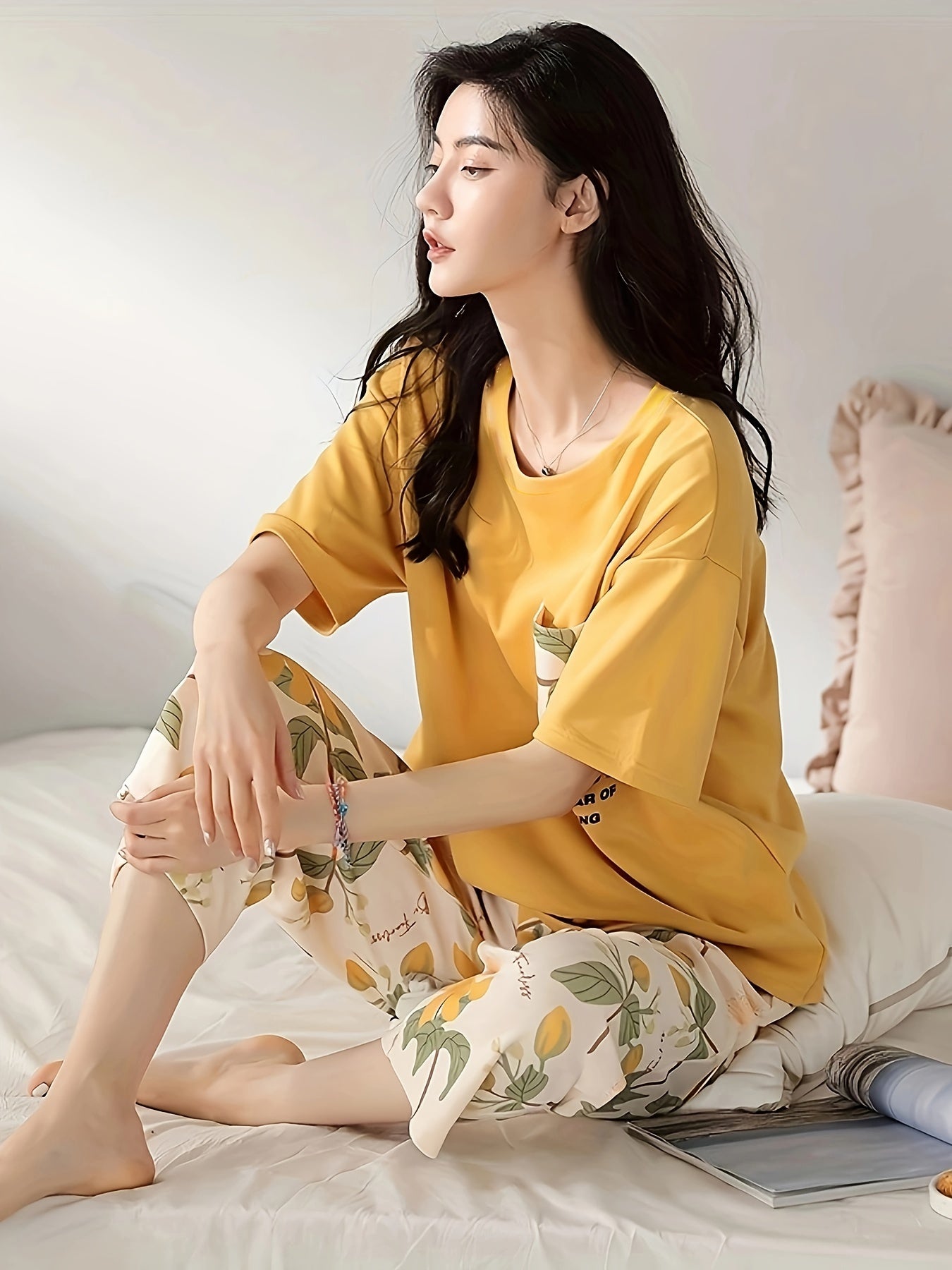 Floral print casual loungewear set for women: short sleeve tee and capri pants for a cozy, relaxed fit at home in summer.