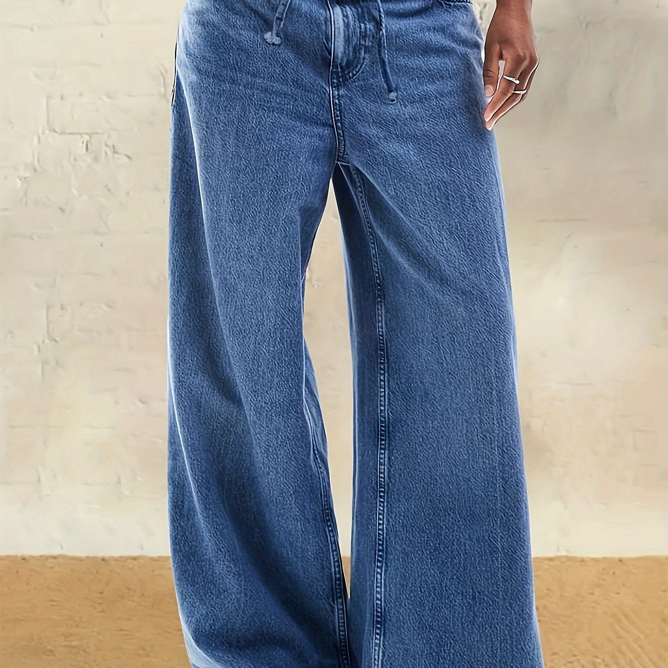 Plus Size High-Rise Wide Leg Denim Jeans in Casual Light Blue. Comfortable, adjustable waistband for all seasons. Casual, relaxed style in a rayon blend.