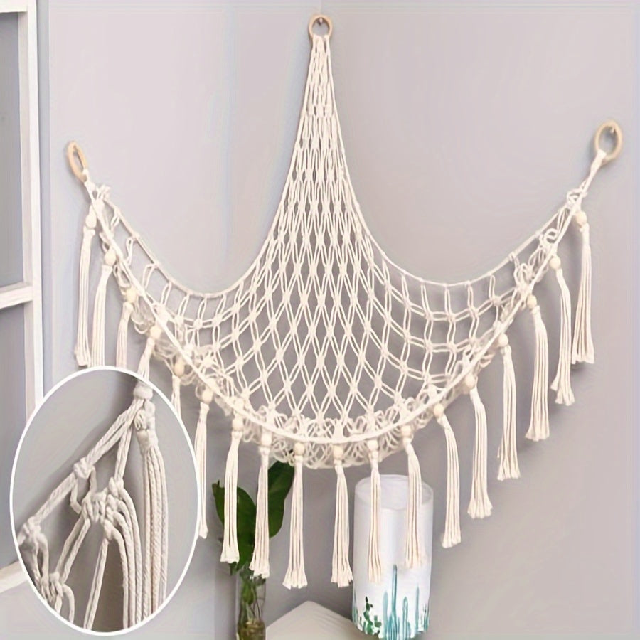 Handmade macrame wall storage net with hooks for toys and plushies. Versatile decor for living room, bedroom, or playroom.