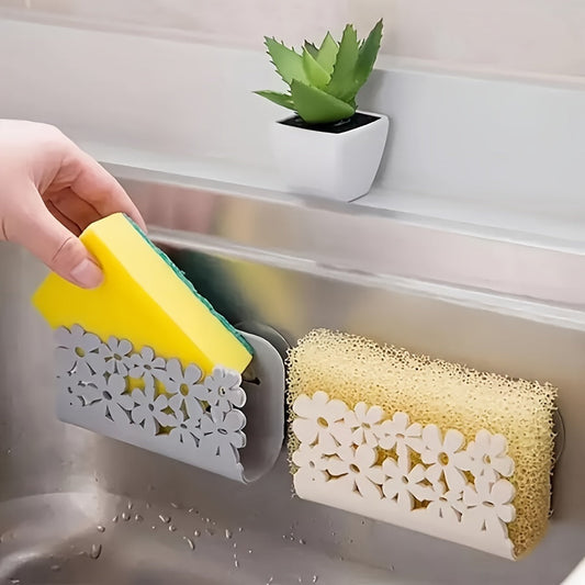 Wall-mounted kitchen sink caddy with floral design, featuring durable plastic construction and two suckers for secure attachment. Perfect for organizing dish sponges and scrubbers in the kitchen. A functional and stylish accessory for home kitchen