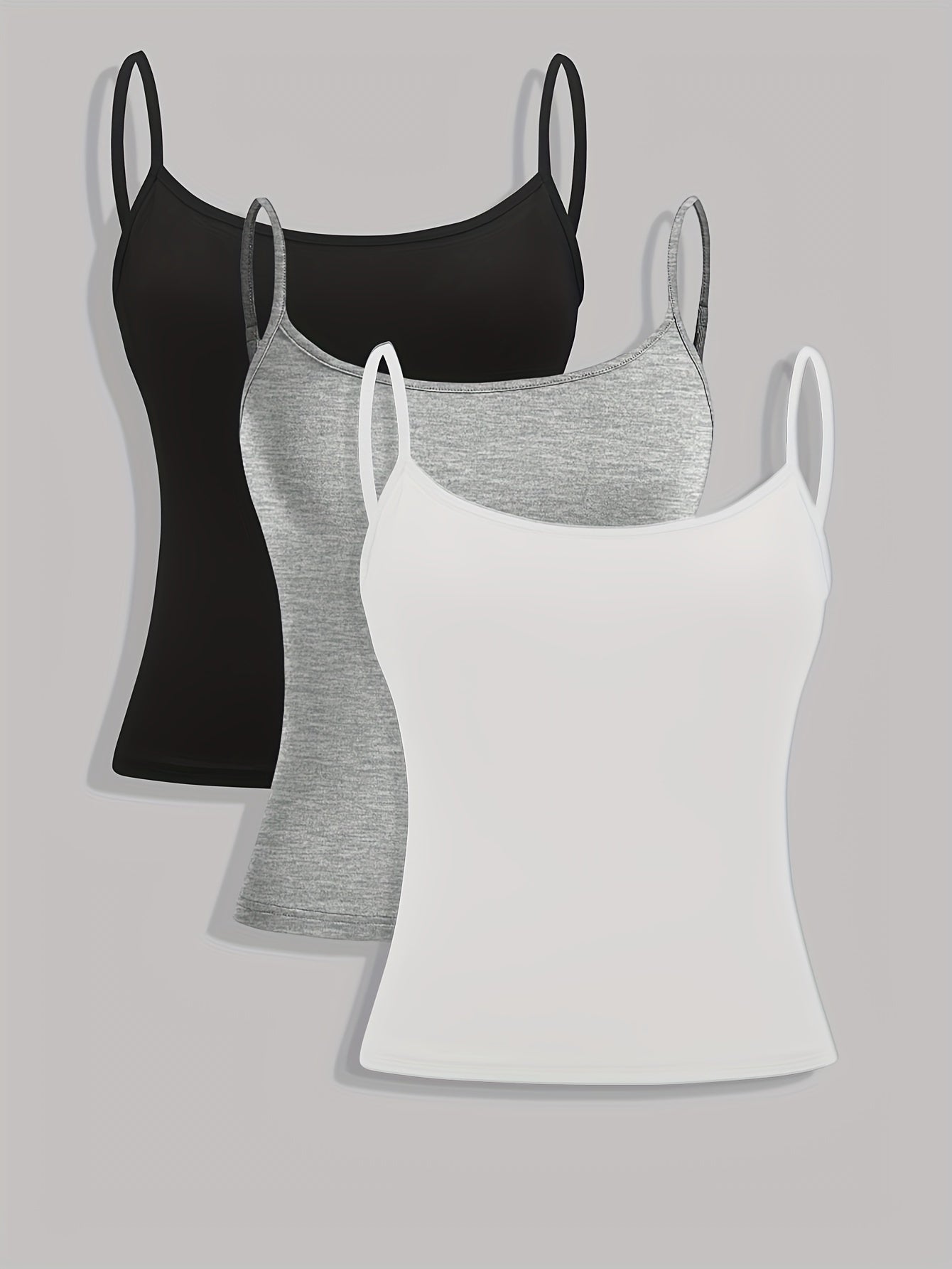 Three solid color women's camisole tank tops.