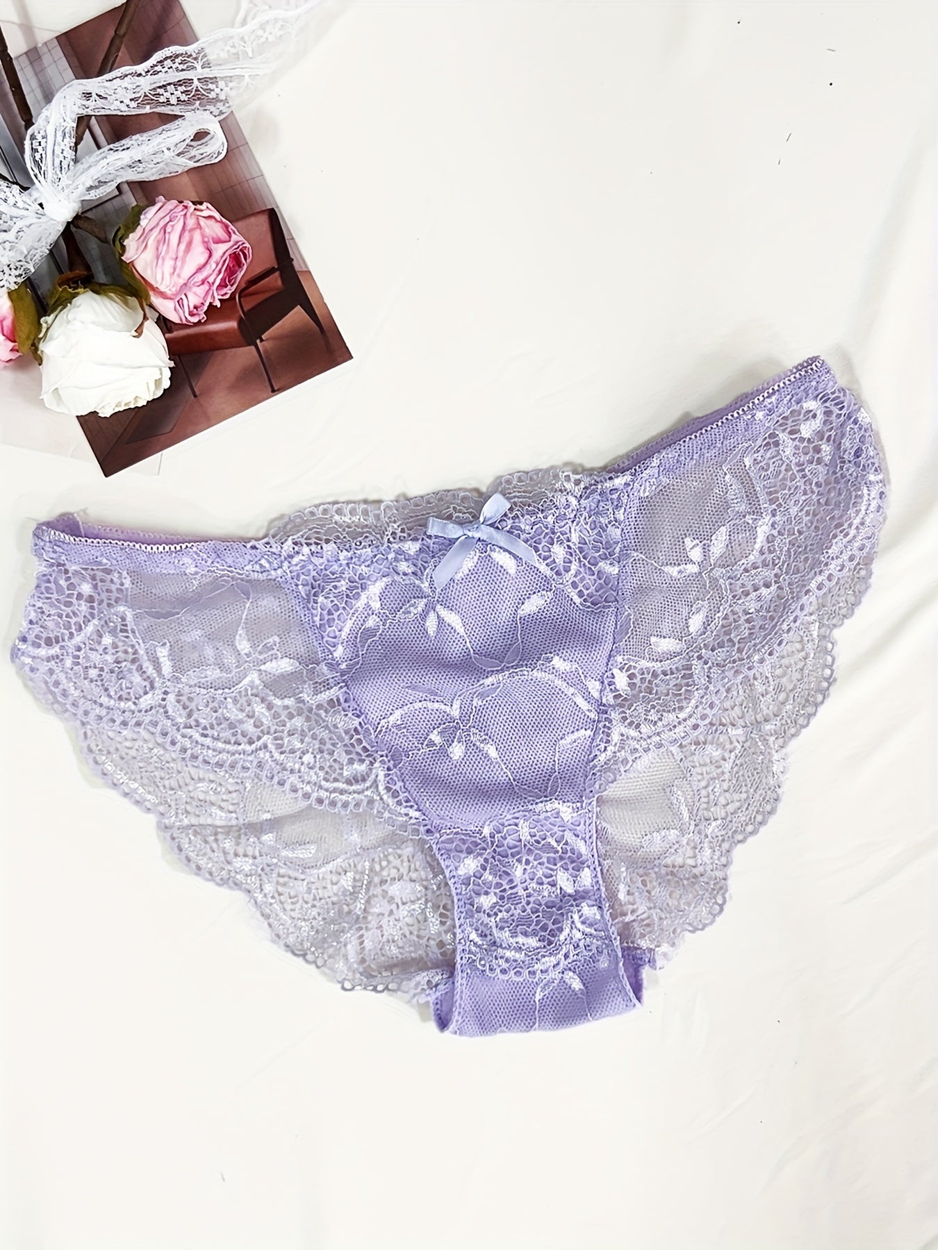 Medium support lace bra and panty set with contrast lace detail, made of 85% polyamide, 7% polyester, 5% elastane, and 3% viscose. Features drop waist briefs and chest pad.