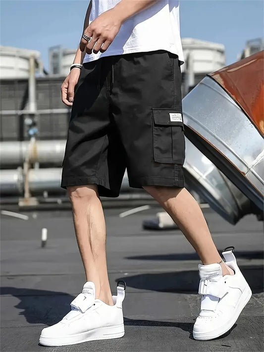 Men's plus-size cargo shorts made of lightweight polyester with pockets, drawstring waist, and suitable for basketball and streetwear.