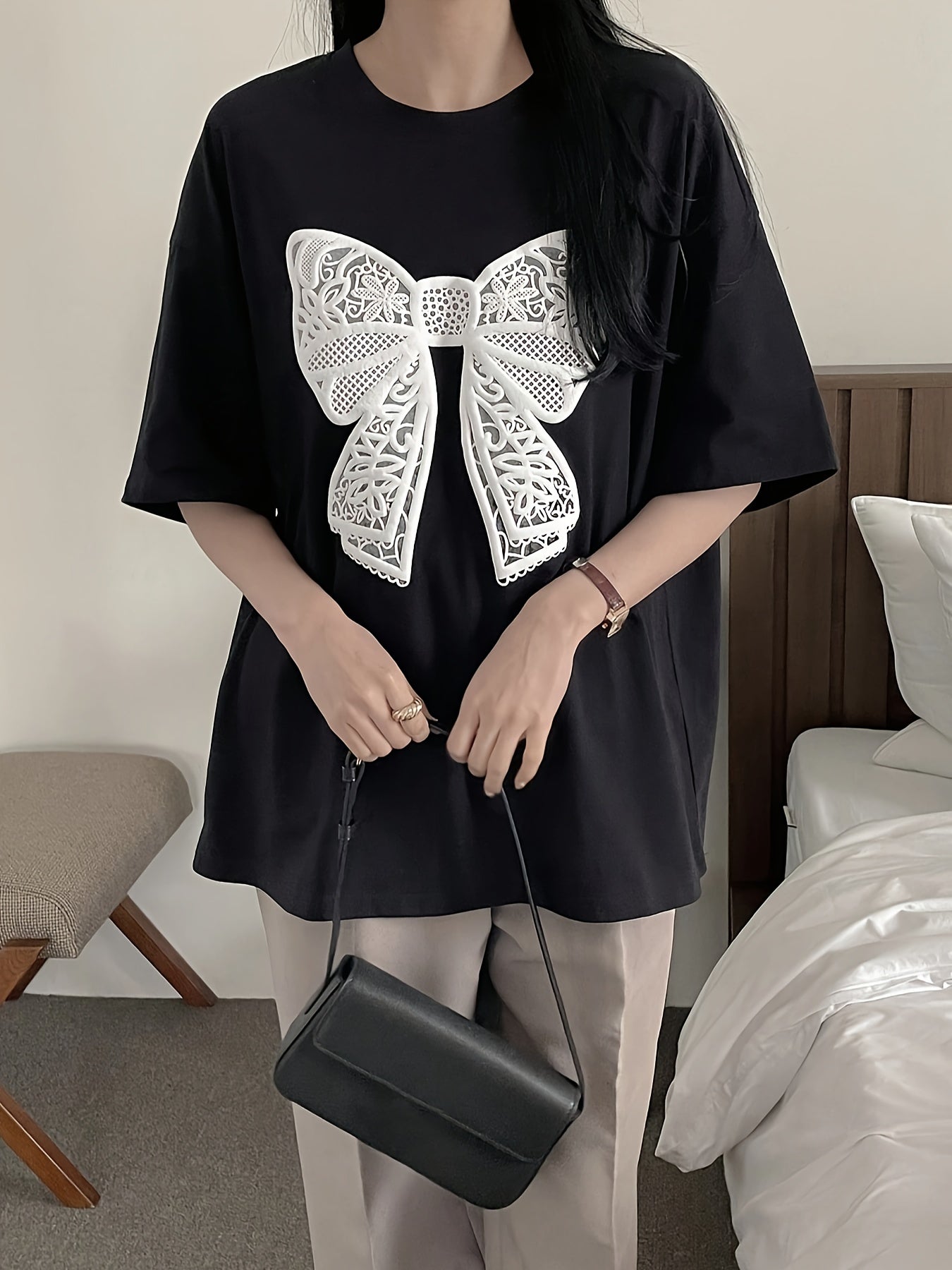 Women's casual crew neck t-shirt with lace bow pattern for spring and summer.