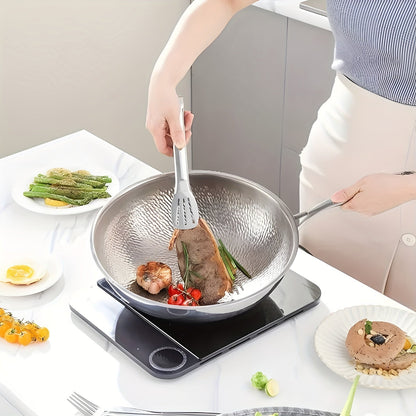 Pure Cook presents the 31.75/33.78cm Titanium-Coated Wok with Lid, featuring Hammered Tri-Ply Stainless Steel. This wok is free from PFOA and PTFE, making it safe for use in dishwashers and ovens.