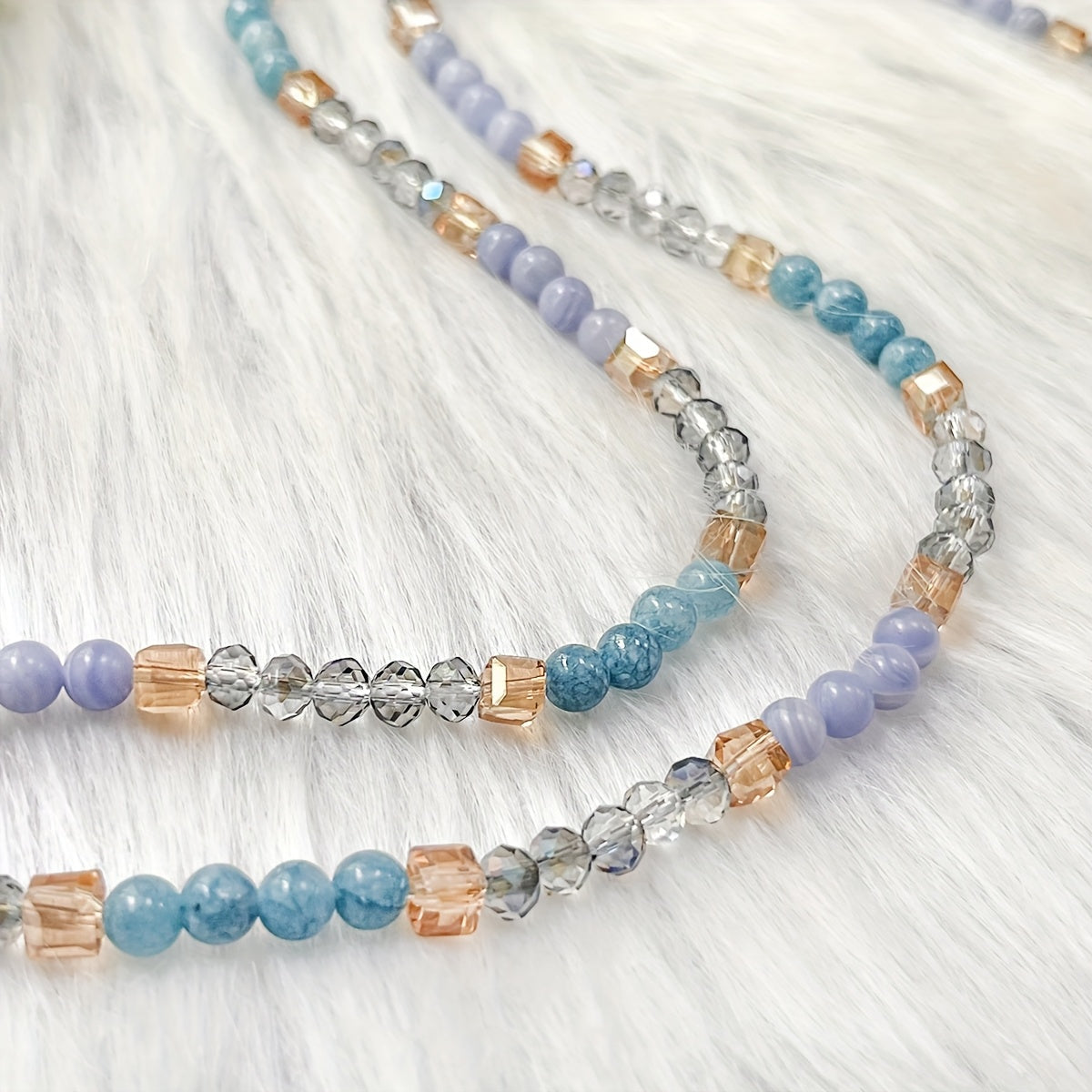 Unique vintage-inspired mala necklace featuring a raw kyanite pendant, beautiful blue lace agate and amazonite beads. Hand-beaded with love, this crystal japamala promotes chakra mindfulness and inner peace. This elegant boho accessory is perfect for any