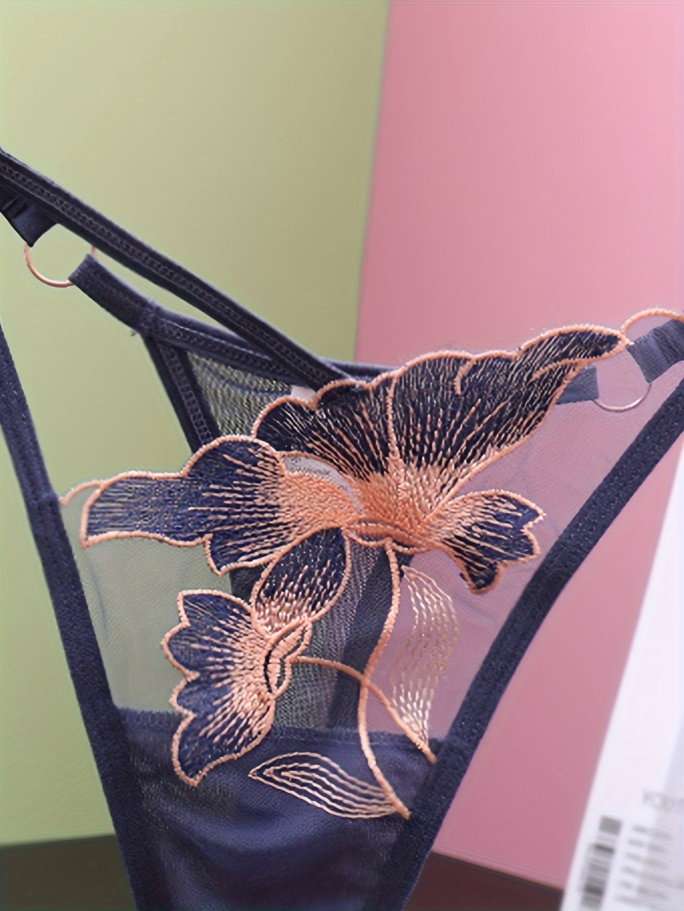 Sexy lingerie and underwear for women, including floral embroidered thongs and seamless mesh panties.