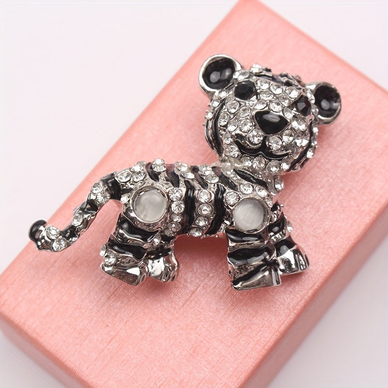 Irregularly shaped, vintage tiger brooch pin with rhinestone accent features a cute tiger design, perfect for men's suit jacket lapels.