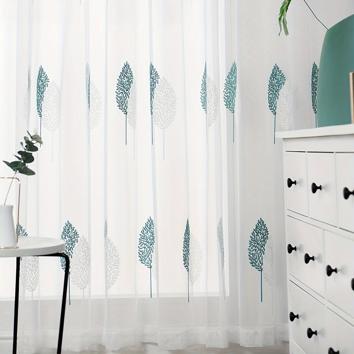 Add a touch of pastoral elegance to your home with this beautiful sheer curtain featuring delicate leaf embroidery. This translucent tulle curtain is easy to hang with a rod pocket design, perfect for adding a subtle touch of style to your living room or