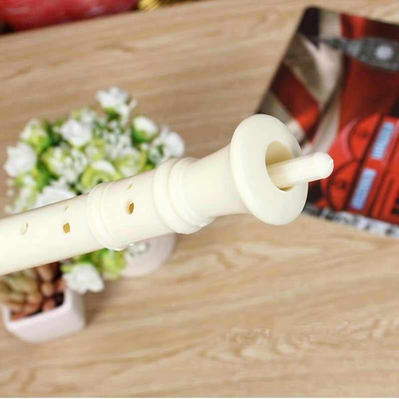 Professional performance plastic white flute with cleaning stick for practice and playing.