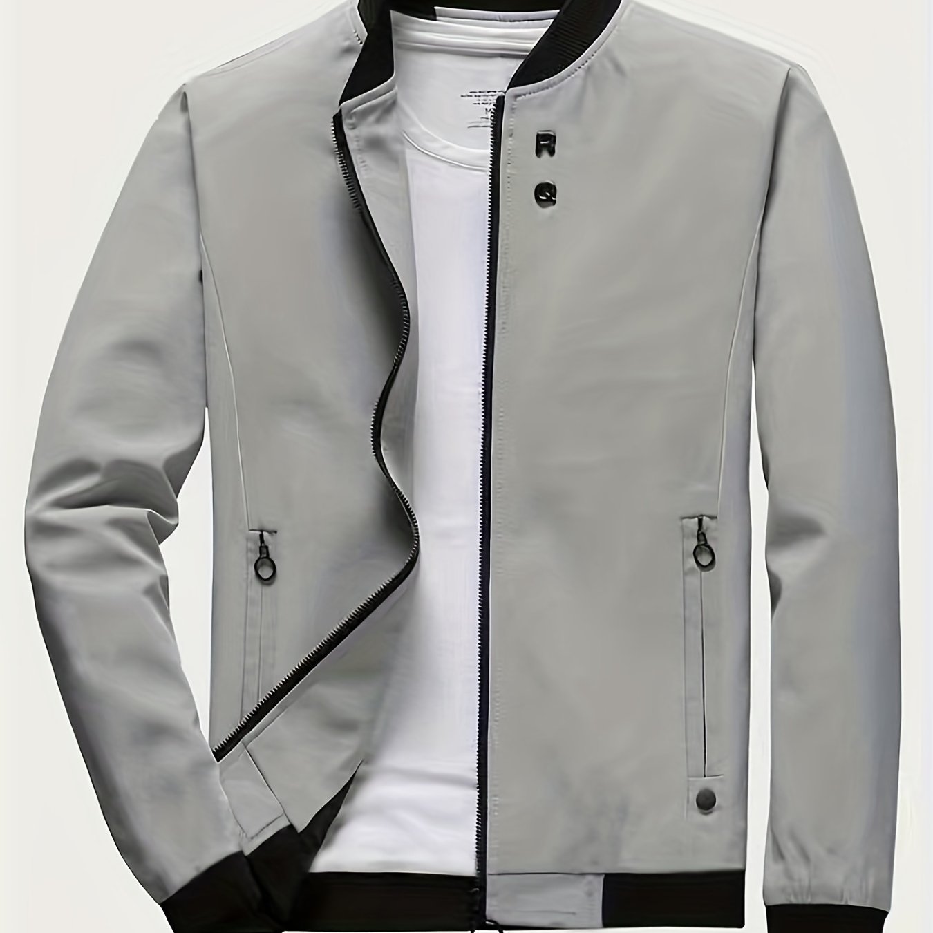 Casual long-sleeved jacket with zip, stand collar, pockets, and slim fit; ideal for spring and autumn.